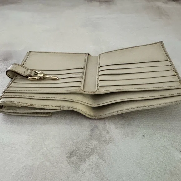 Gucci Guccissima Ivory Leather GG Logo BiFold Wallet, Gold Piston Closure
